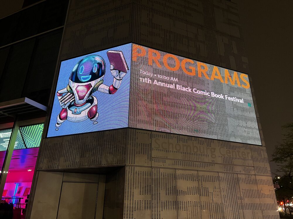 Schomburg Center digital signage listing the 11th Annual Black Comic Book Festival programming